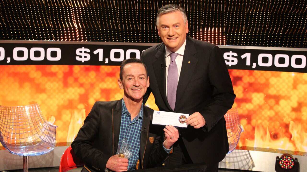 Antony McManus and Milionaire Hot Seat host, Eddie McGuire after his win.