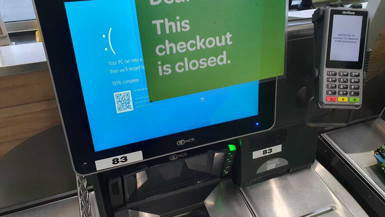 A checkout terminal with a "blue screen of death".