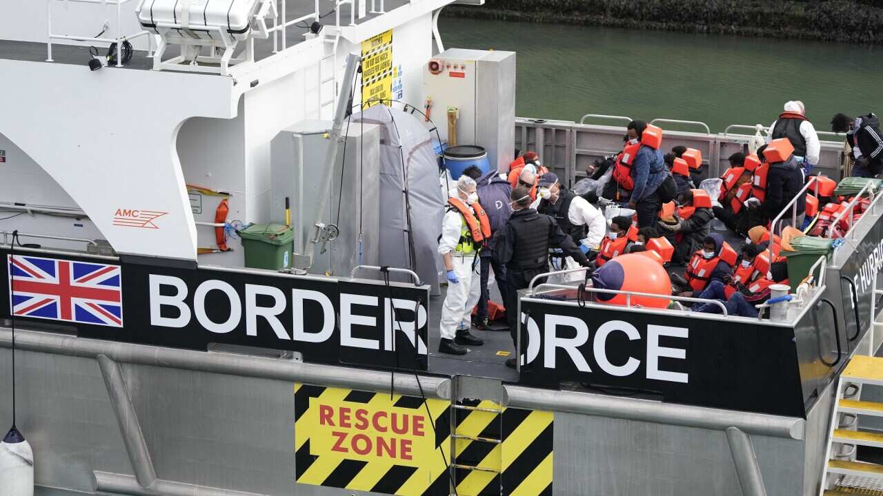 Asylum seekers on board a British Border Force vessel in Dover, southeast England.