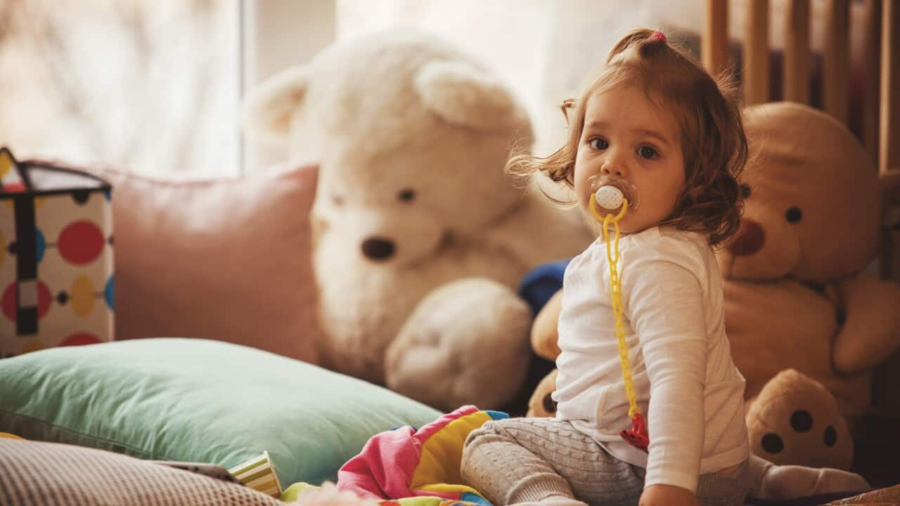 Baby girl with pacifier