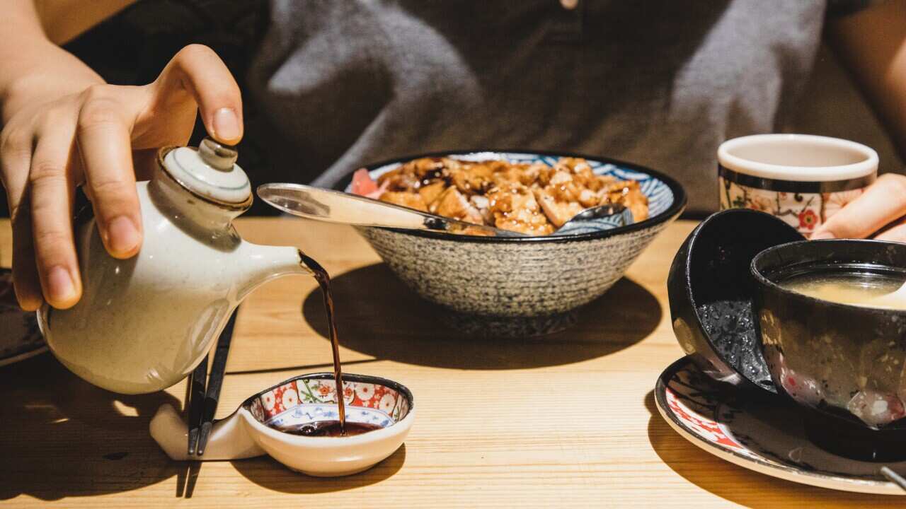 Soy sauce is being served as apart of a meal