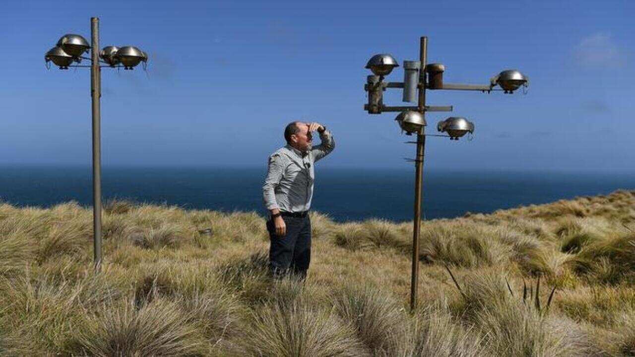 Photo taken on February 25, 2019 show Sam Cleland, the officer in charge of the Cape Grim Baseline Air Pollution Station, posing in Cape Grim, Tasmania. - As the Asia-Pacific wheezes, coughs and sniffles its way through another smog season, one isolated a