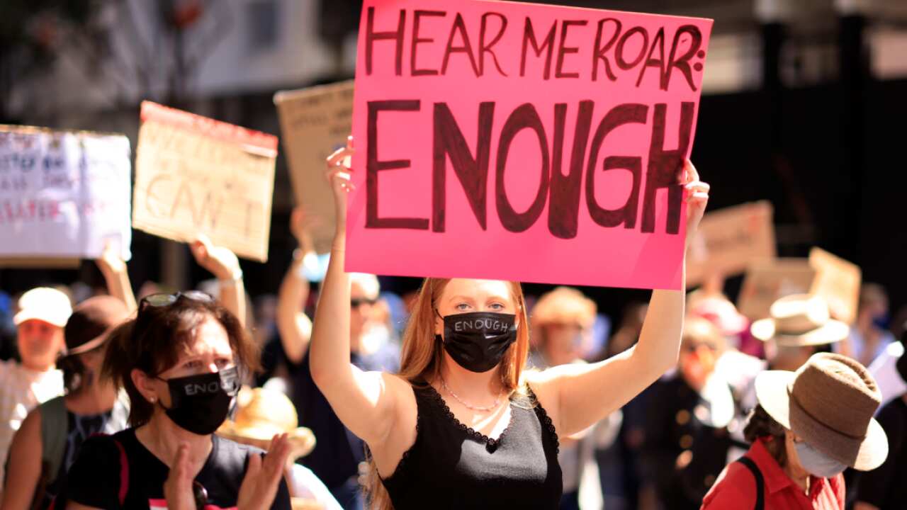 Women march in Sydney to demand action against gendered violence in Australia.