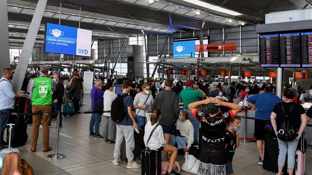 Queues of people are seen at the Virgin and Jetstar departure terminal at at Sydney Domestic Airport in Sydney, Wednesday, April 13, 2022. (AAP Image/Bianca De Marchi) NO ARCHIVING