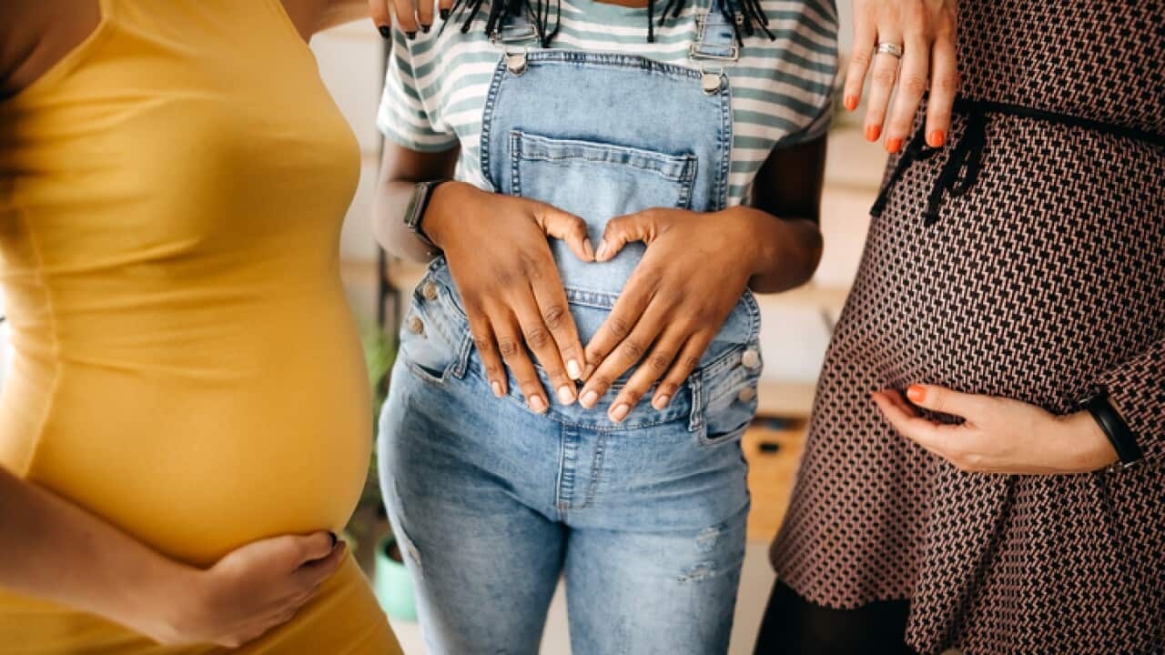 Three pregnant women together