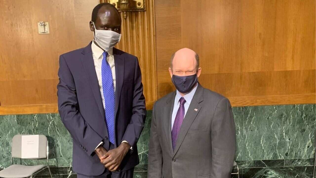 Peter Biar Ajak and the US Senator Christopher Andrew Coons