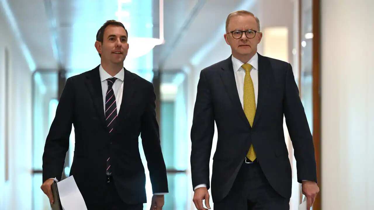 Treasurer Jim Chalmers and Prime Minister Anthony Albanese arrive at a press conference at Parliament House in Canberra on 11 July 2022.