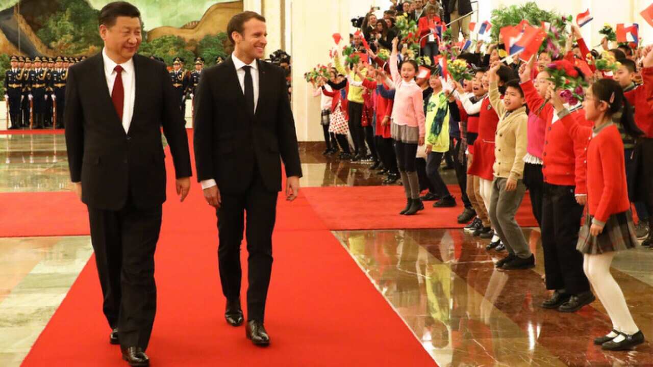 Xi Jinping, left, and Emmanuel Macron in Beijing