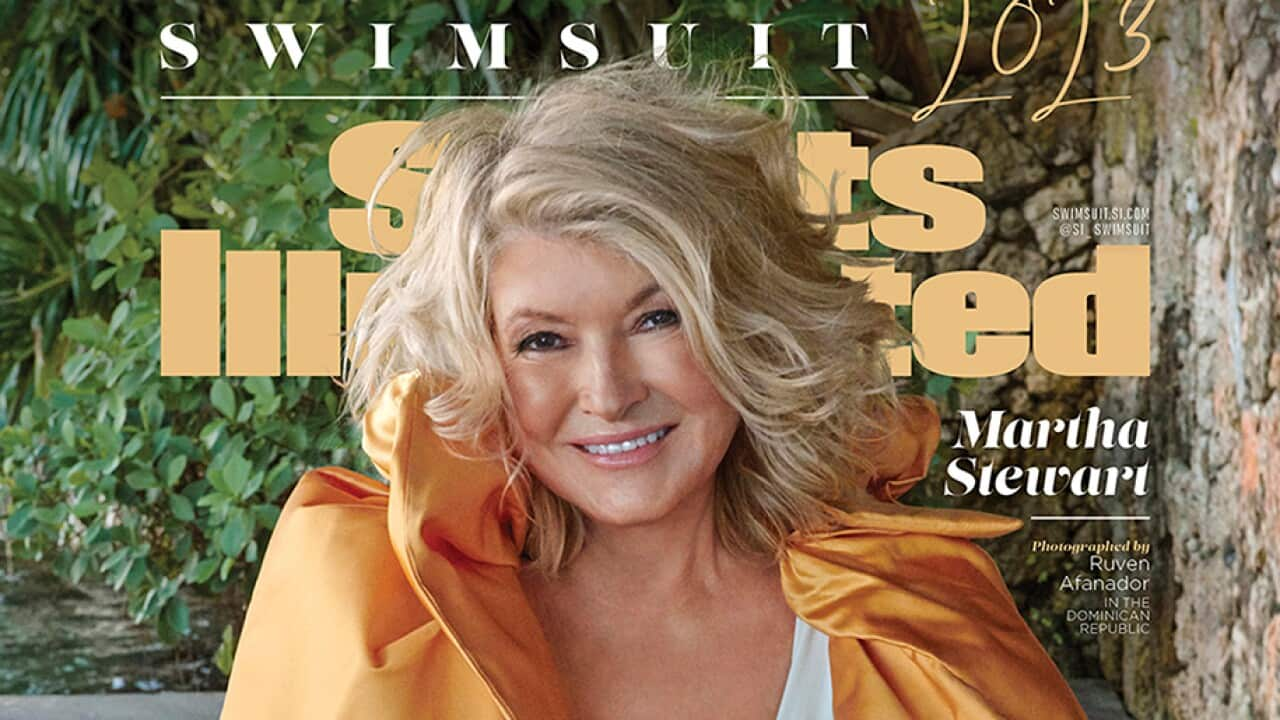 Martha Stewart in white swimsuit and orange jacket on the cover of Sports Illustrated Swimsuit edition 2023.