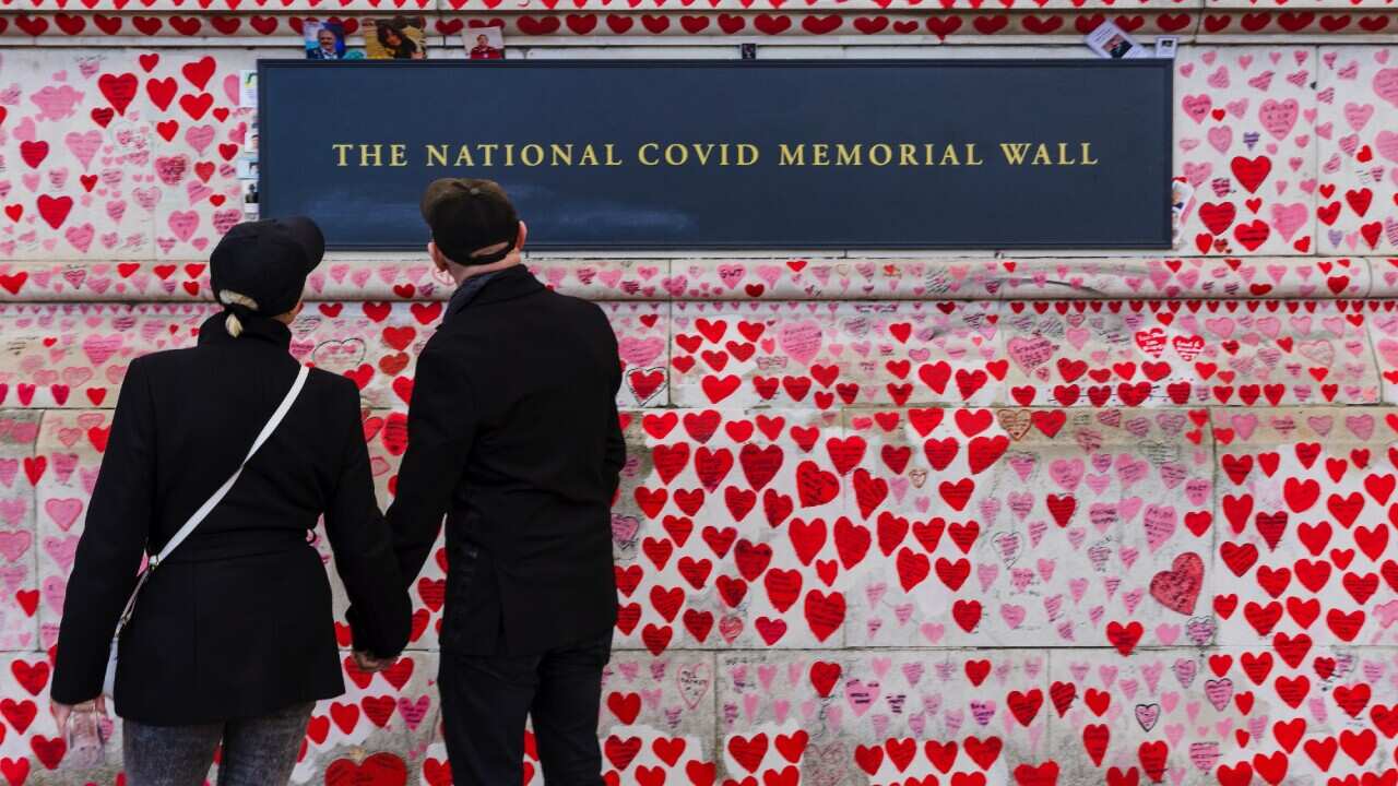 In London, people visit the National COVID Memorial Wall, a tribute to those who died from coronavirus. 