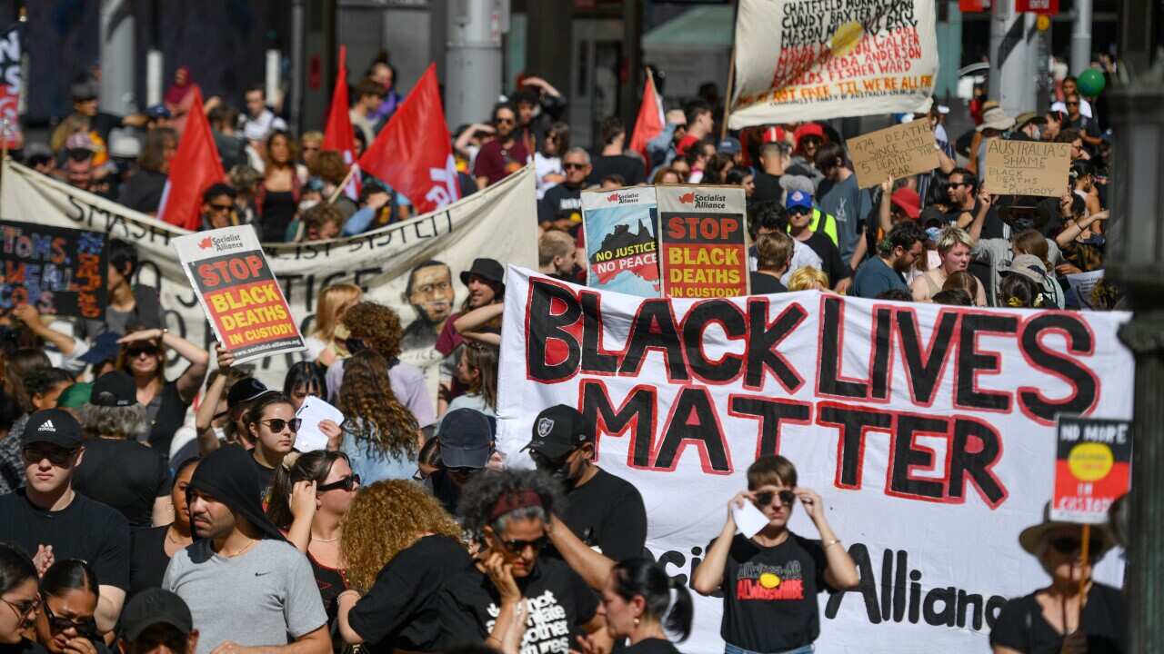 Protesters at a Black Deaths in Custody Rally at Town Hall in Sydney.