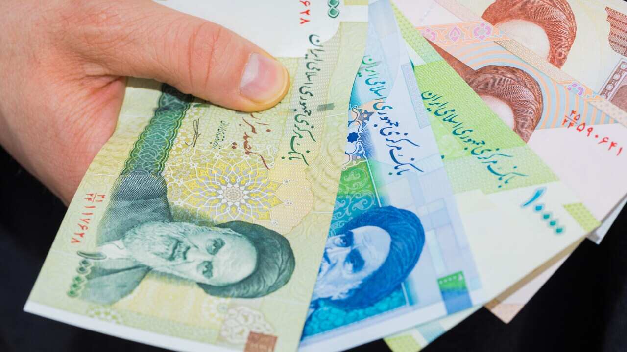 Iranian Riyal Money, Various Values, Banknotes spread out and held in the hand