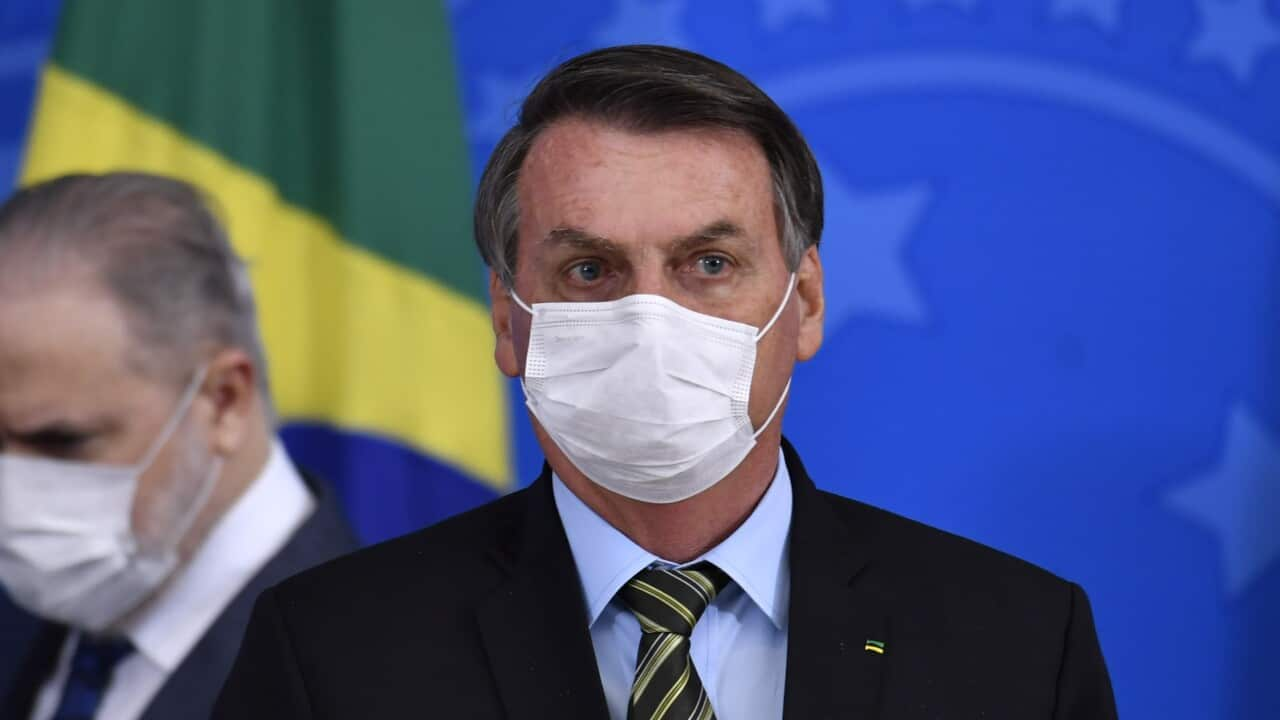 Brazil's President Jair Bolsonaro and Attorney General of the Republic Augusto Aras wearing protective masks.