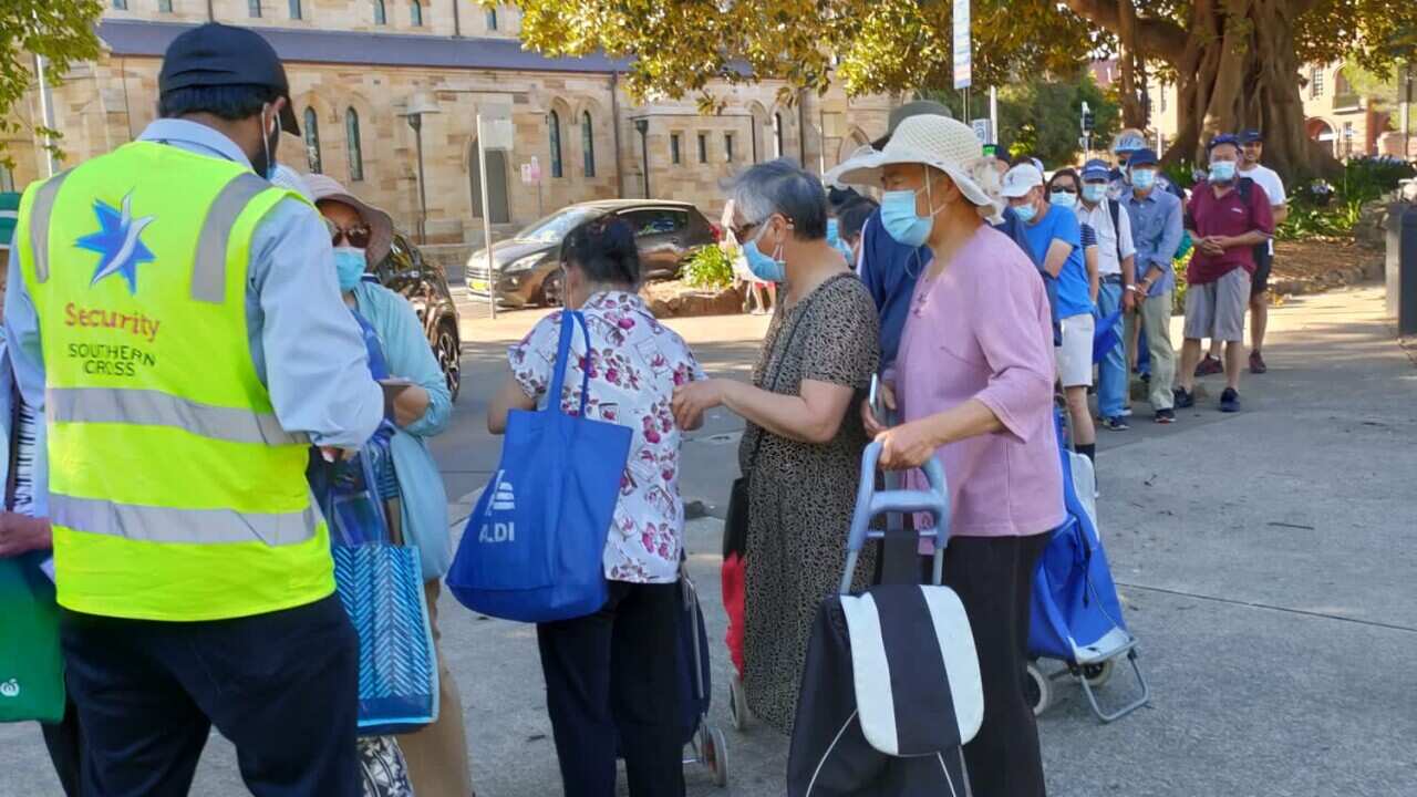 Language barrier prevents charity from understanding increase in elderly Asians queueing for food handouts.