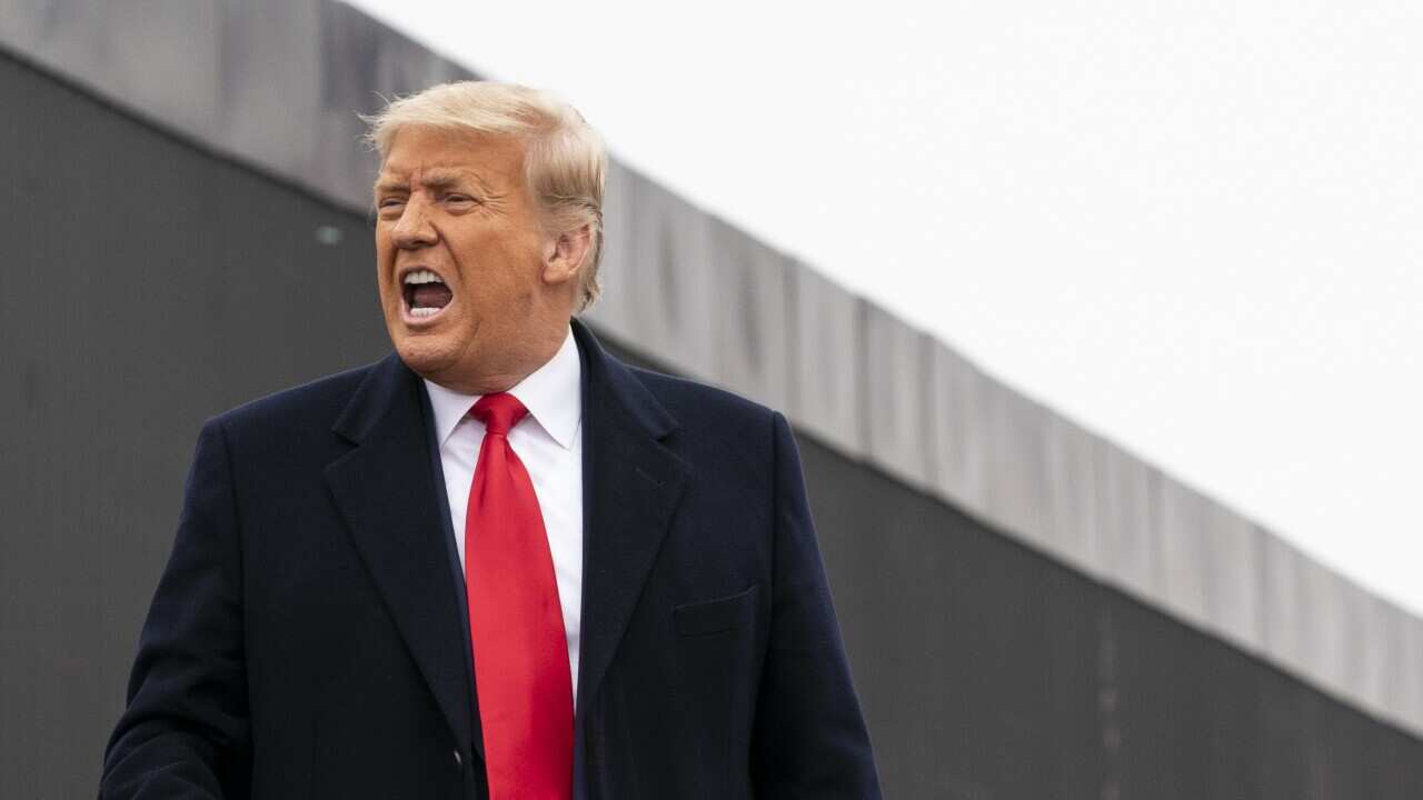 Donald Trump visiting a section of the US-Mexico border wall on Jan 12, 2021, in Alamo, Texas. 