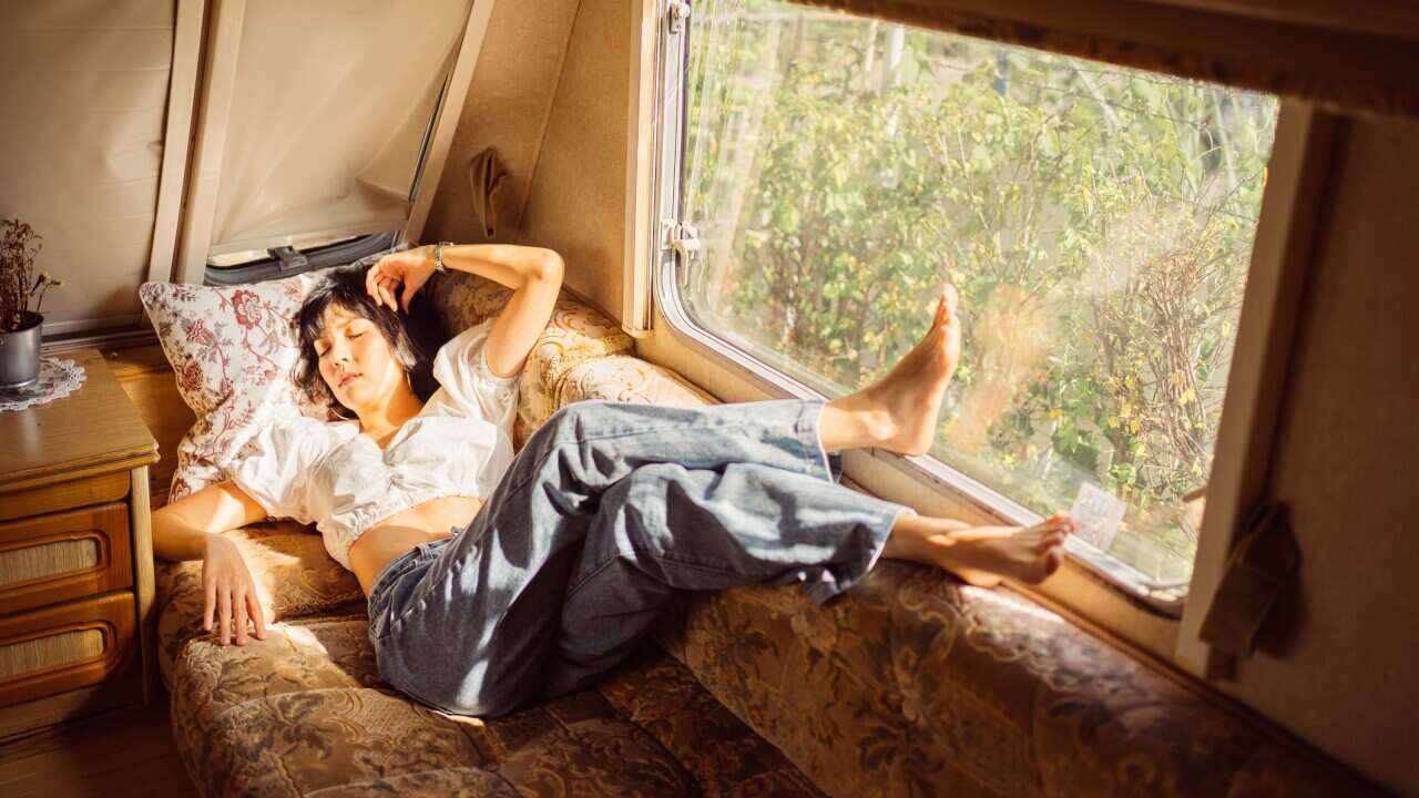 Close up portrait Asian female feeling lonely in camper vans