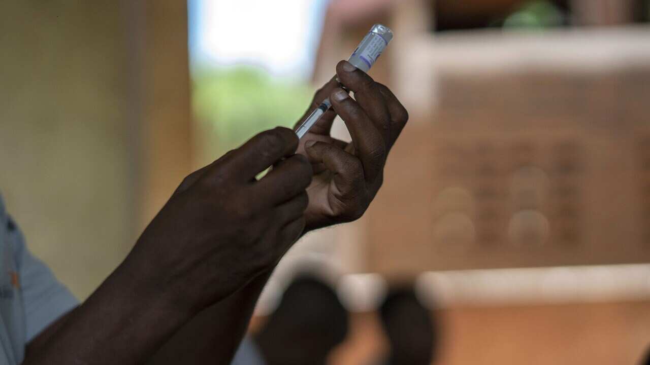 : Health officials prepare to vaccinate residents of Malawi against malaria (AAP).