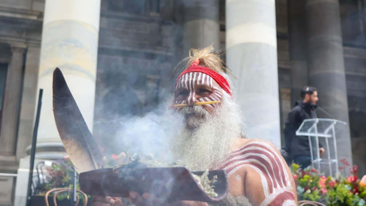 A man performing smoking ceremony.