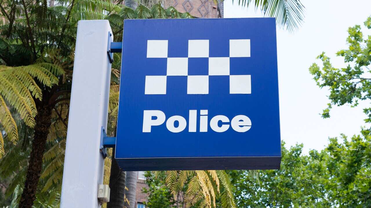 An armed man has died after police were forced to shoot him on Sydney's northern beaches.