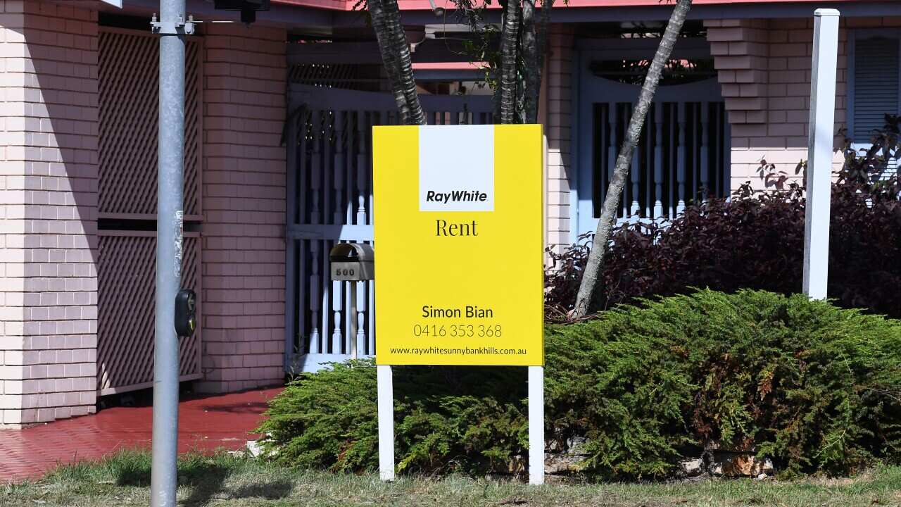 A rental sign outside a house.