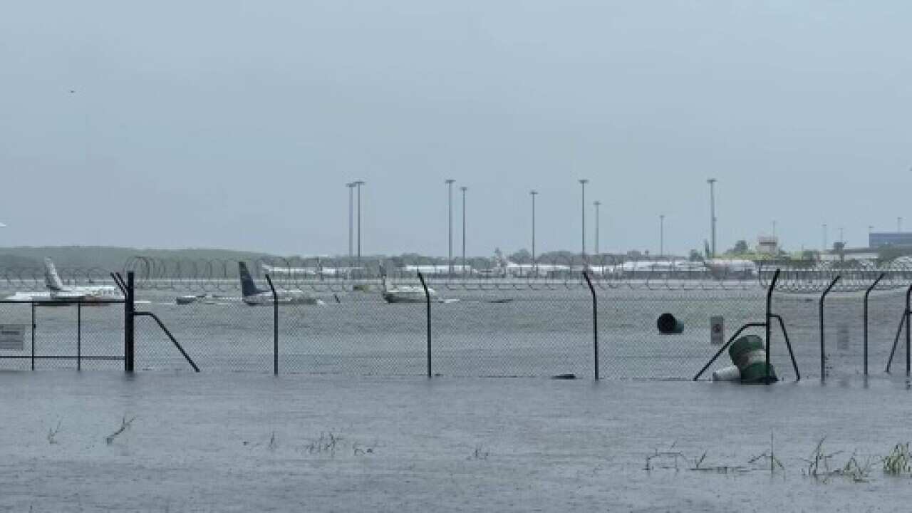 Planes are seen at a flooded airport