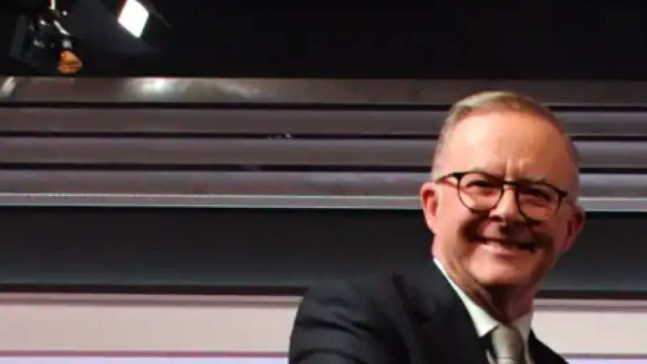 Prime Minister Scott Morrison (right) and Opposition Leader Anthony Albanese shake hands at the start of the final leaders' debate.