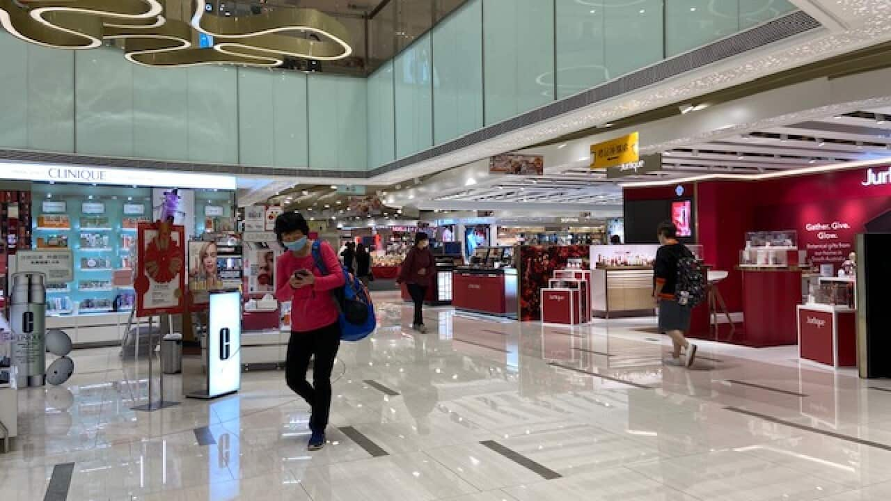 people wearing mask at a shopping center in Hong Kong