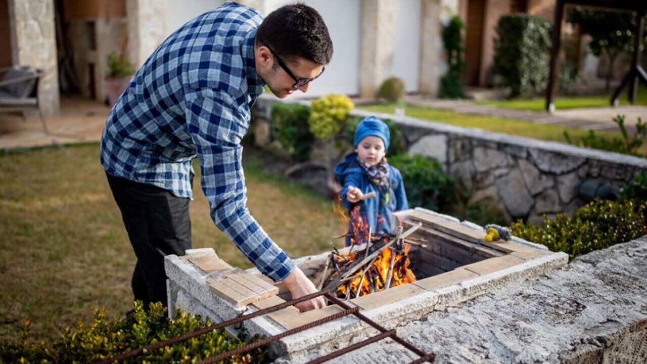 father and child at the barbecue