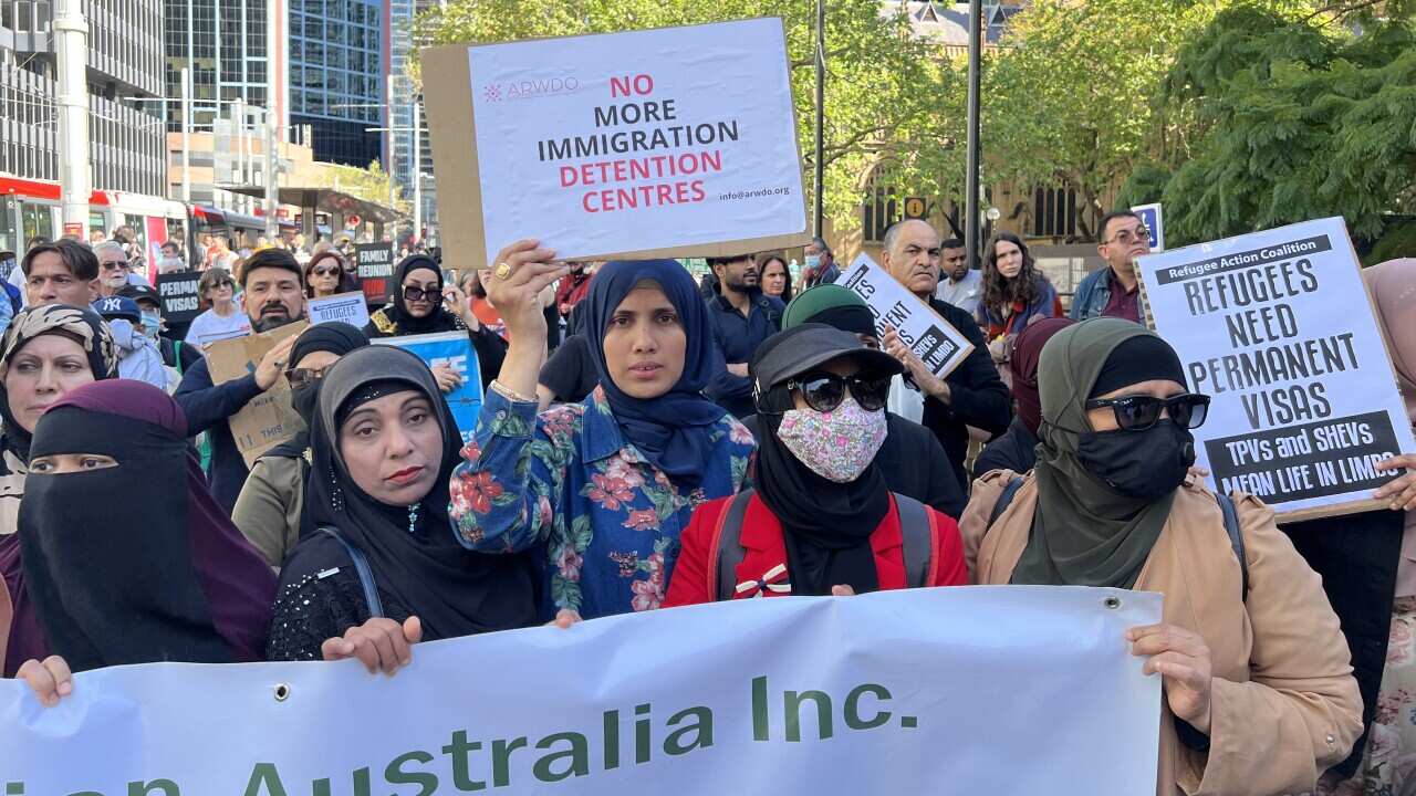 Refugees and asylum seekers protesting on a busy street in Sydney