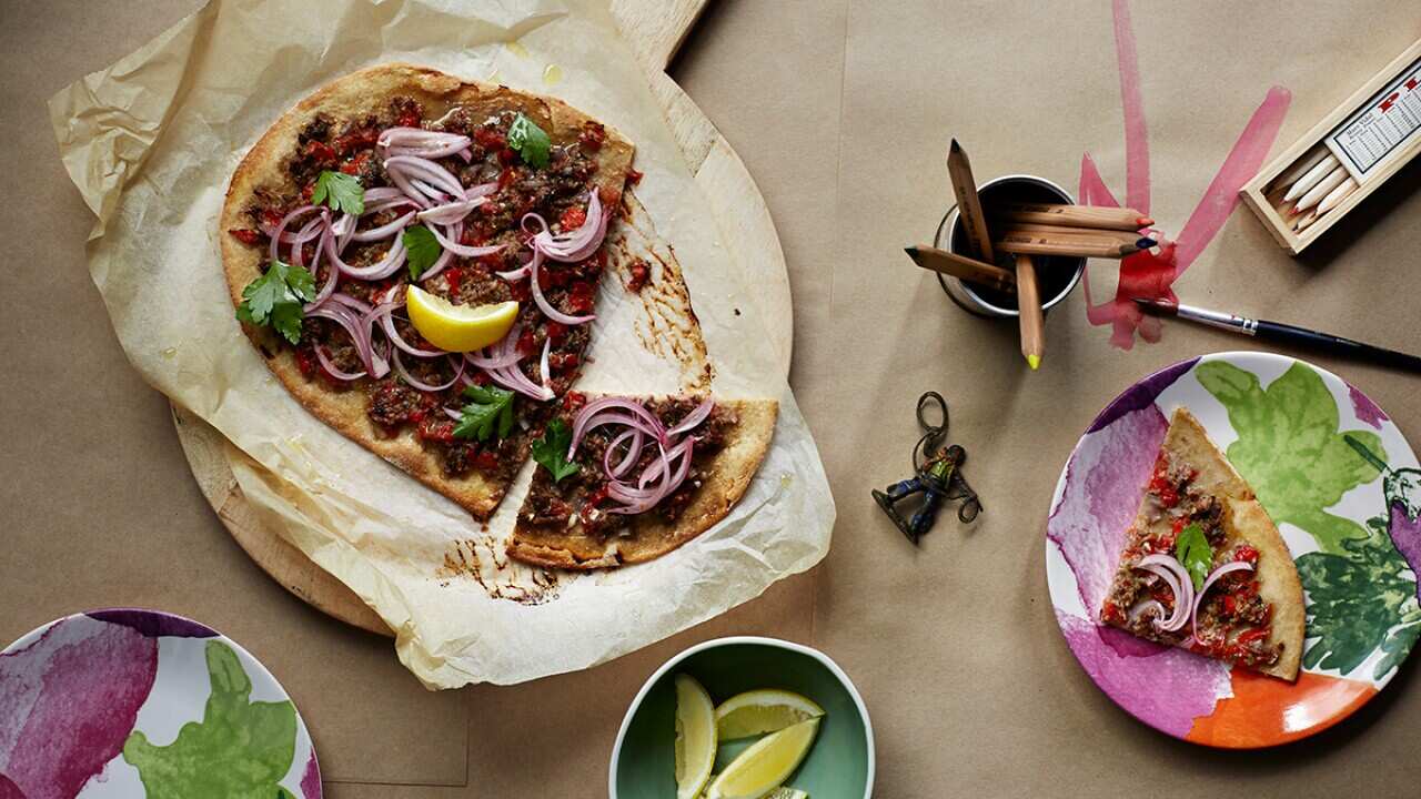 Spicy lamb pizza with pickled red onions