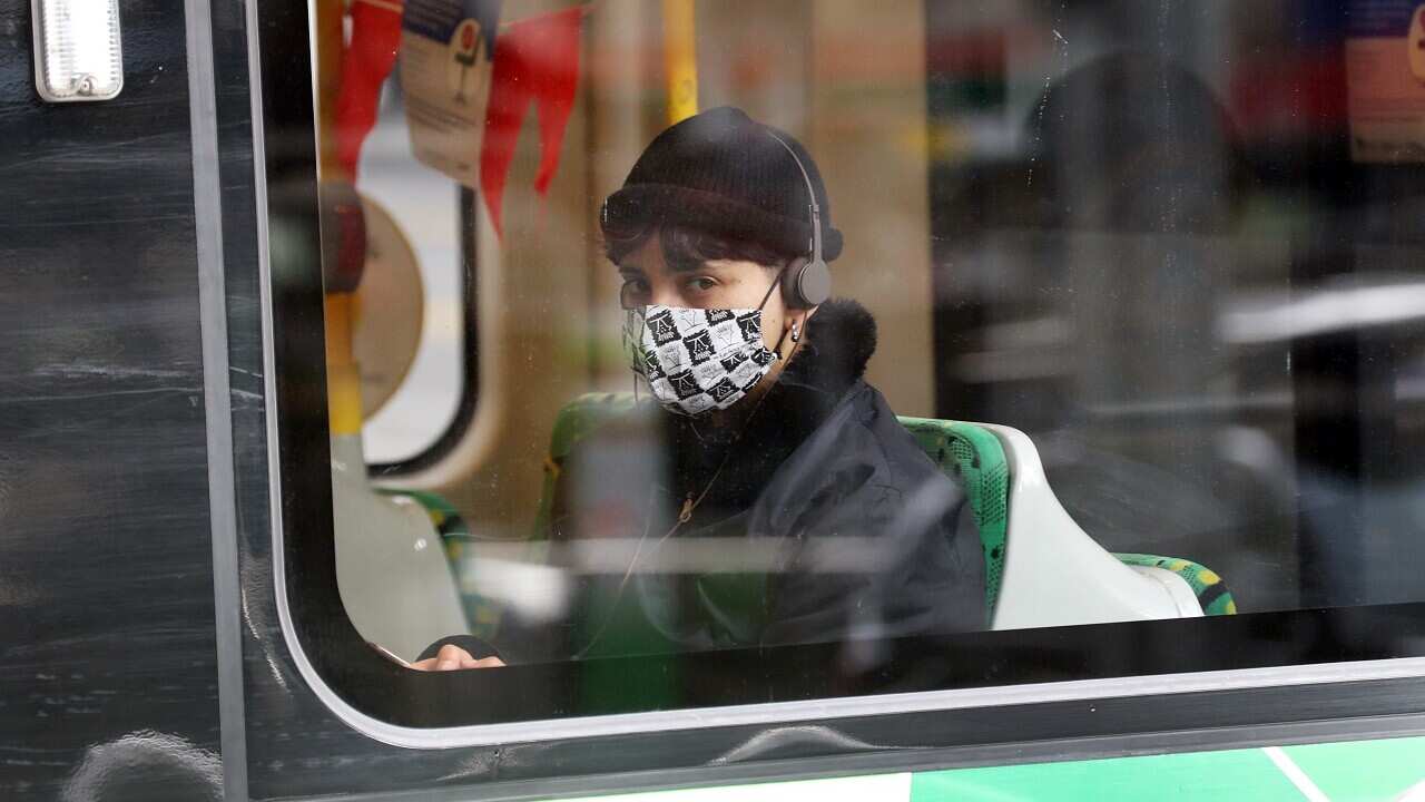 A tram passenger wearing a mask in Melbourne.