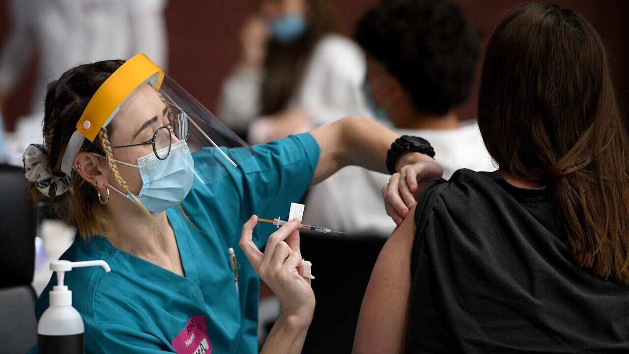 Members of the Indigenous community are seen receiving a Covid-19 vaccine at a pop-up vaccination clinic at the National Centre of Indigenous Excellence in Redfern, Sydney, Saturday, September 4, 2021. (AAP Image/Dan Himbrechts) NO ARCHIVING