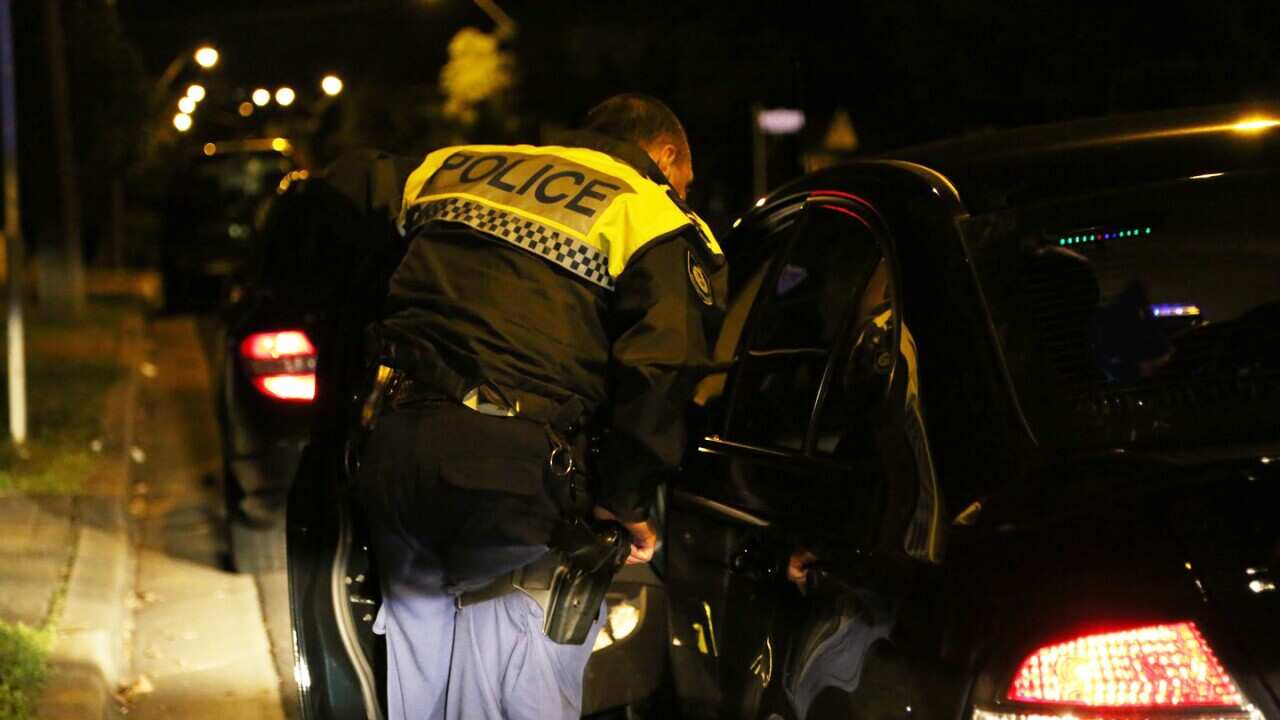 Police stop a car in Sydney