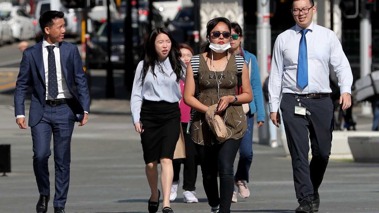 Office workers walk through Yagan Square in Perth.