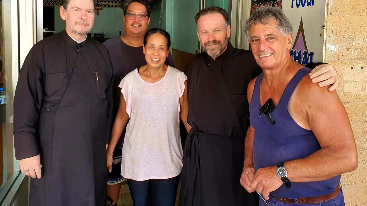 Fr Dimitri Tsakas and Fr Roman with Lismore locals