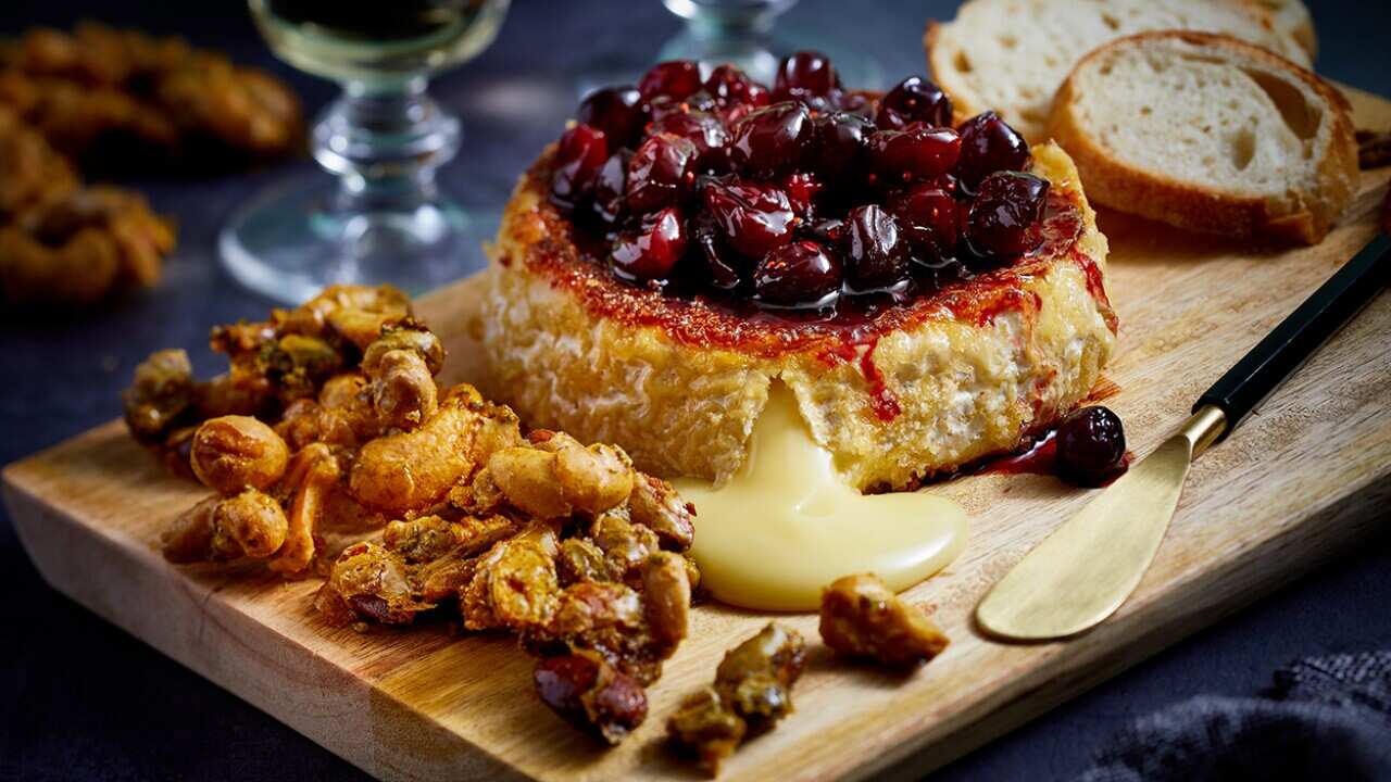 Camembert with cranberry jam and spiced nuts