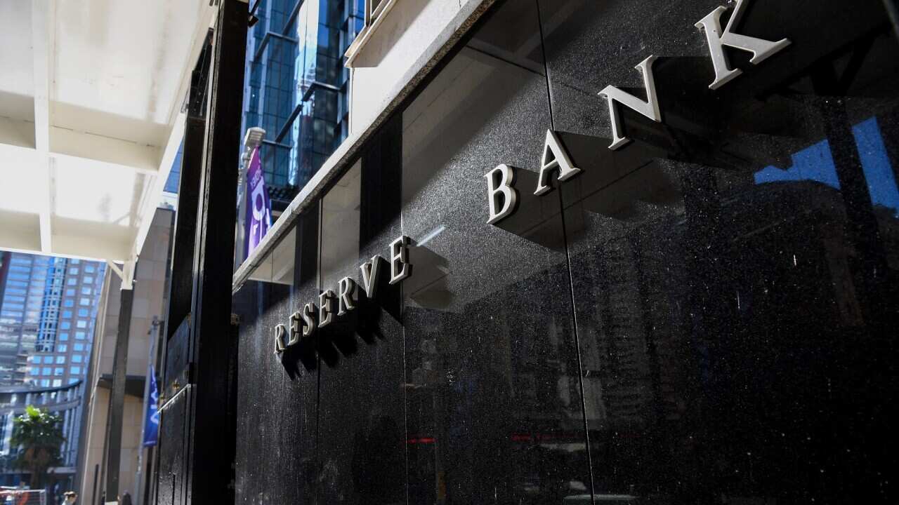 A pedestrian walks past the Reserve Bank of Australia (RBA) head office in Sydney, Tuesday, June 7, 2022. The Reserve Bank of Australia board holds its monthly meeting ahead of an announcement on interest rates. (AAP Image/Bianca De Marchi) NO ARCHIVING