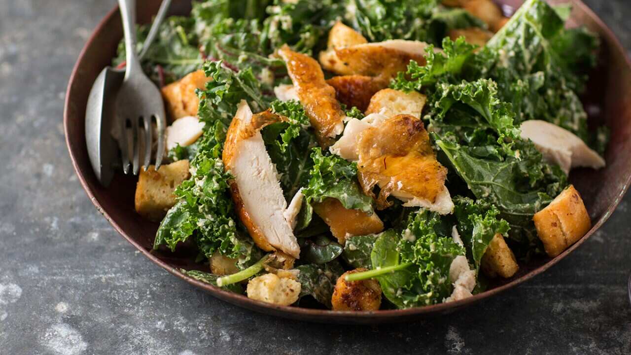 Kale Caesar salad with roast chicken