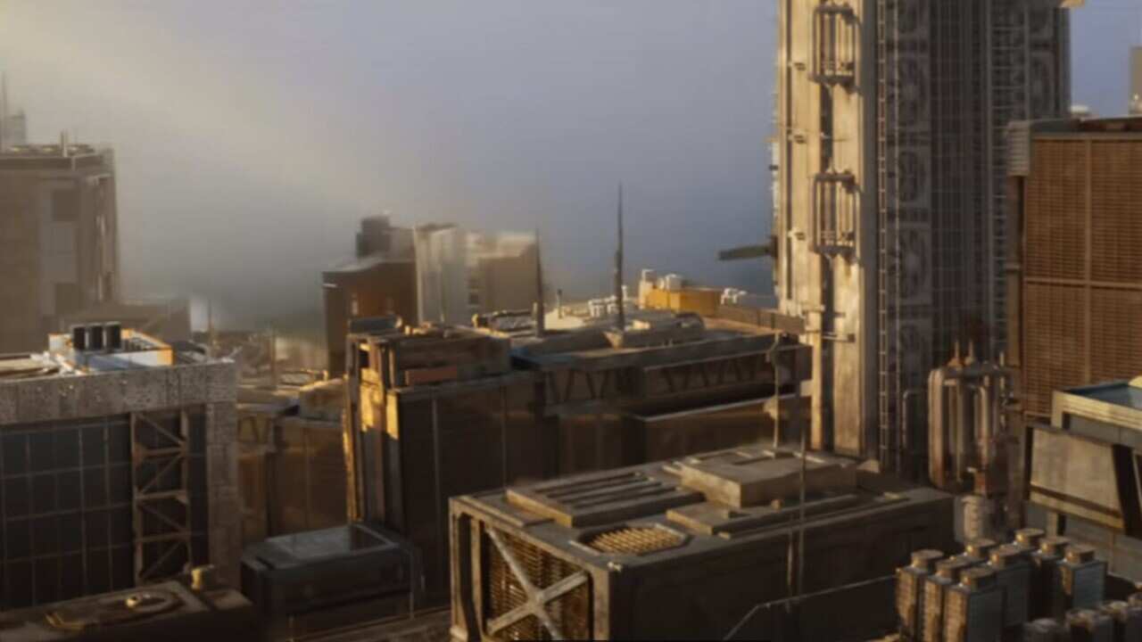 A screenshot of a movie showing a skyline just before the full force of a massive explosion impacts buildings.