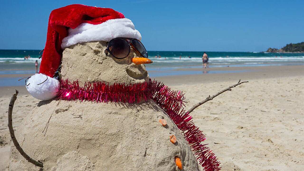 File image from 2014: A Christmas Day celebration on the beach in Sydney. 