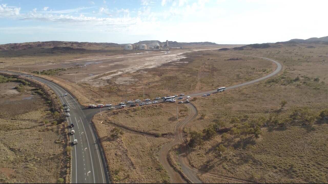 Protestors have blockaded the road following the approval of Woodside's Scarborough gas project.