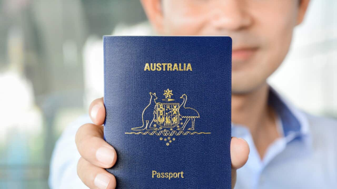 A man showing passport (of Australia)