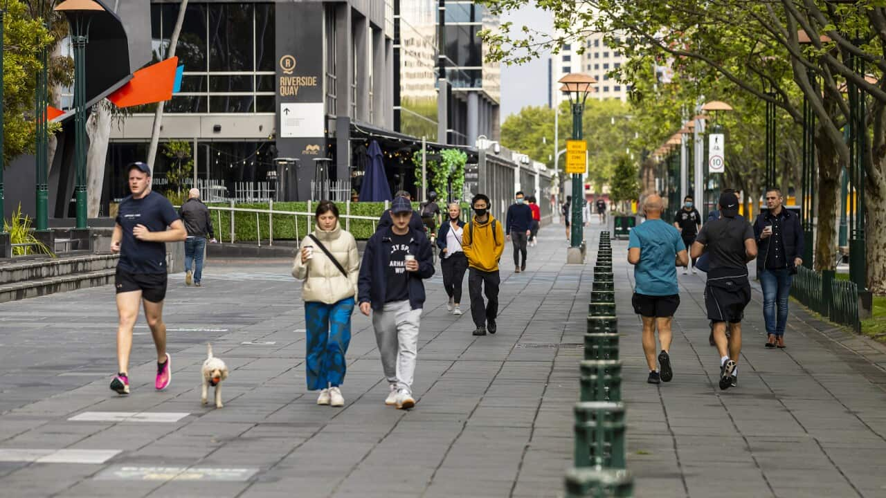 People are seen exercising along Southbank in Melbourne, Thursday, September 30, 2021. 