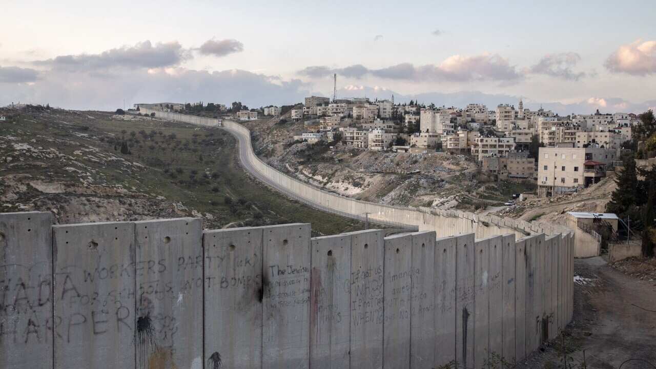  A wall separates Abu Dis, West Bank, from Jerusalem, Jan. 30, 2020. 