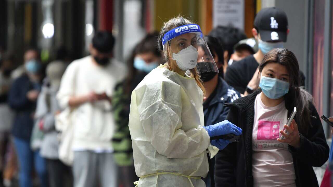 People queue at a walk-in COVID-19 testing site in Melbourne on Wednesday, 5 January 5, 2022. 