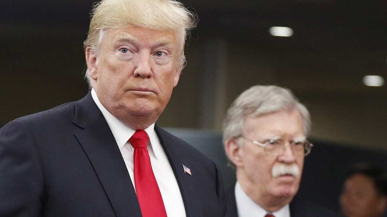 US President Donald Trump (L) with US National Security Adviser John Bolton (R) in September 2018.