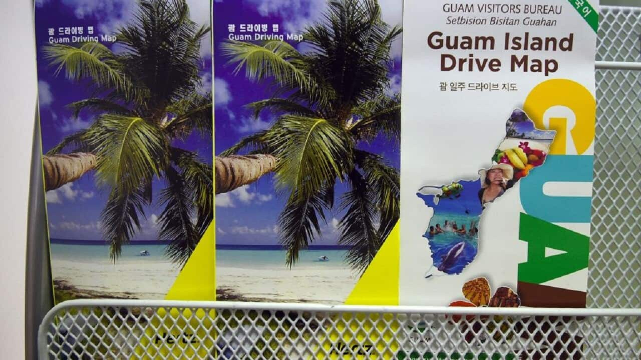 Maps for driving around Guam are displayed outside the Seoul office of the Guam Visitors Bureau in Seoul.