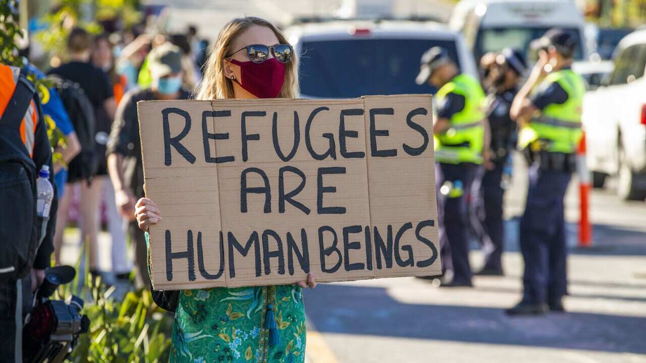 Protesters gather to support asylum seekers detained at the Kangaroo Point Central Hotel.