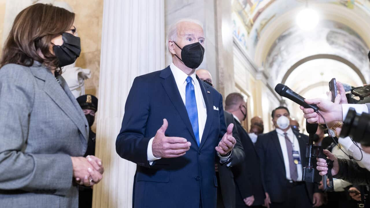 President Joe Biden and Vice President Kamala Harris speak to reporters at the US Capitol Building. 