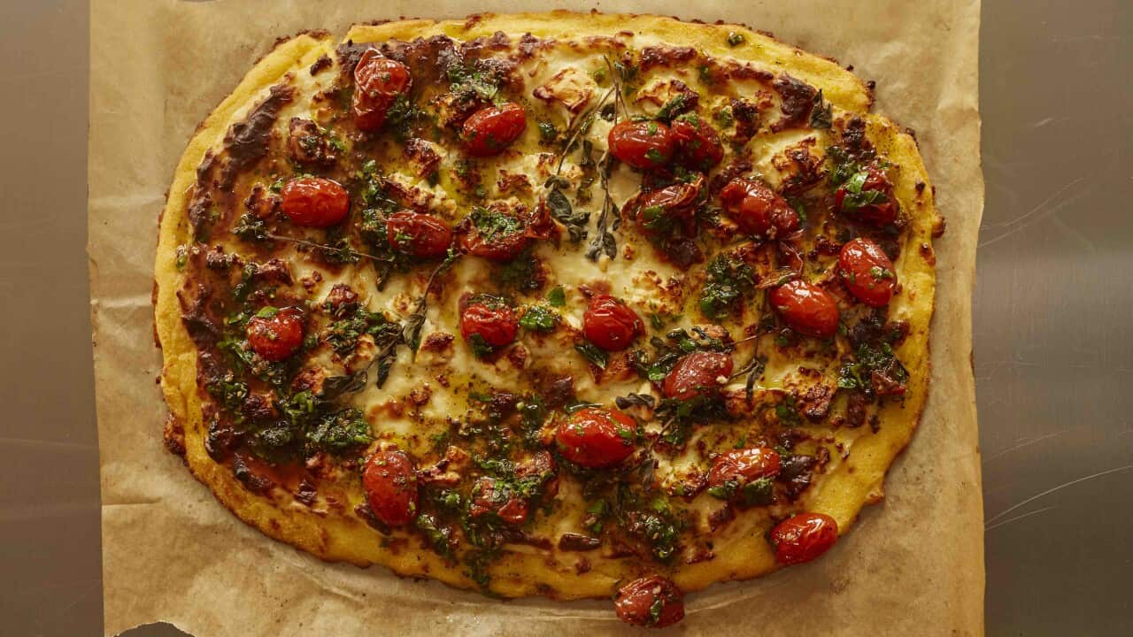 Baked polenta with feta, béchamel and za’atar tomatoes